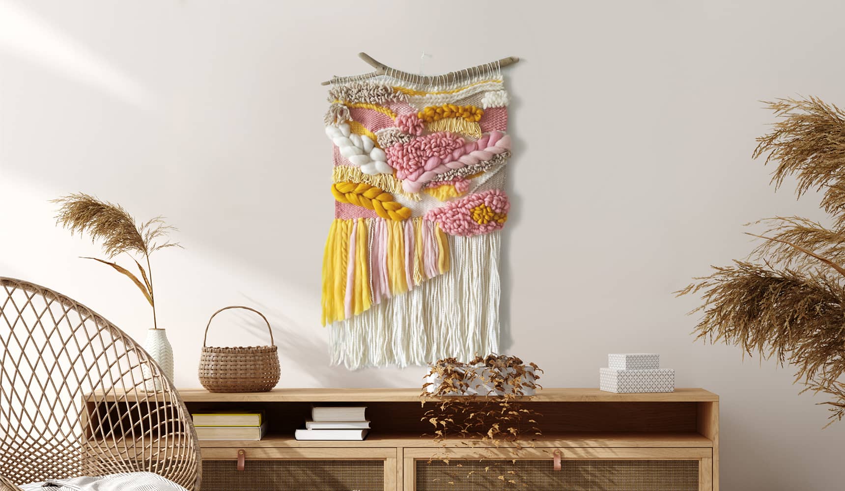 Yellow and pink woven wall hanging finished with a cord of hanging and made of wool and cotton