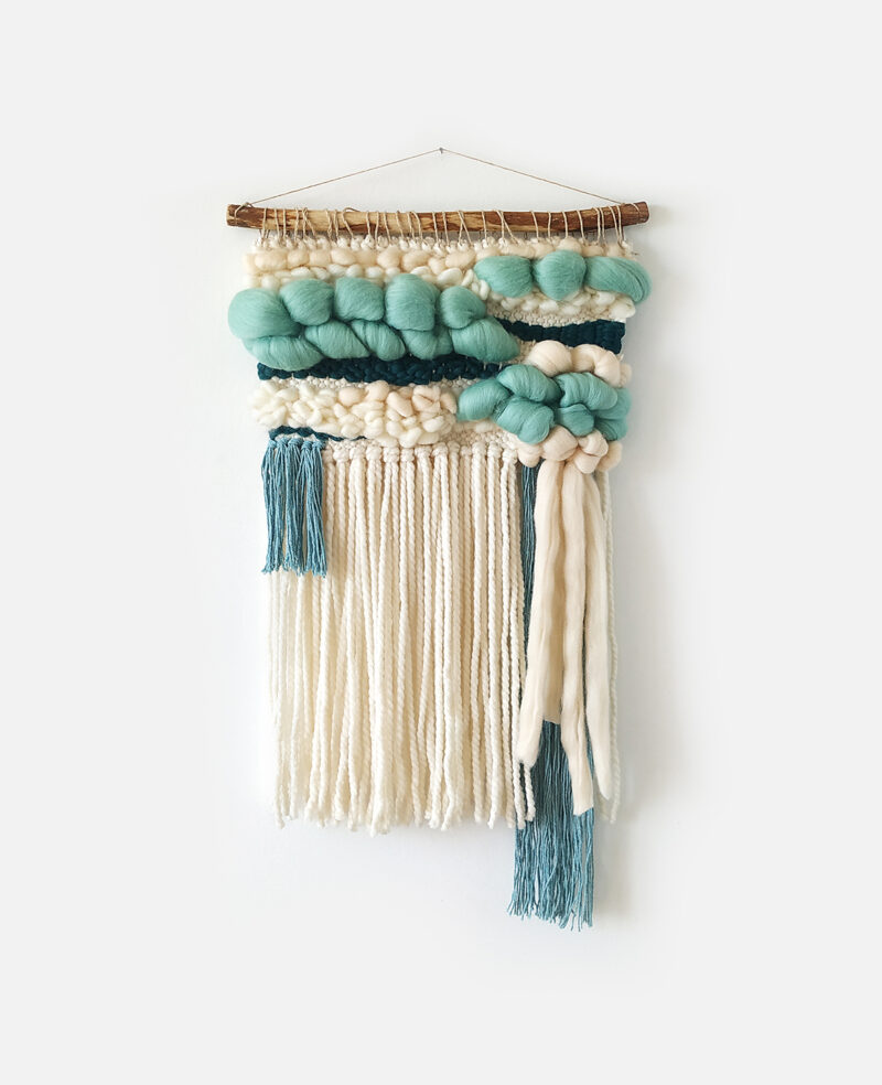 Small teal and ivory woven wall hanging