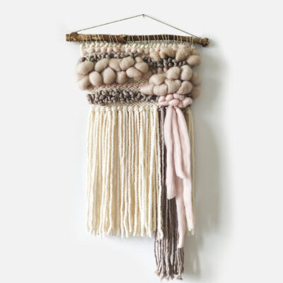 Small dusty pink and beige woven wall hanging